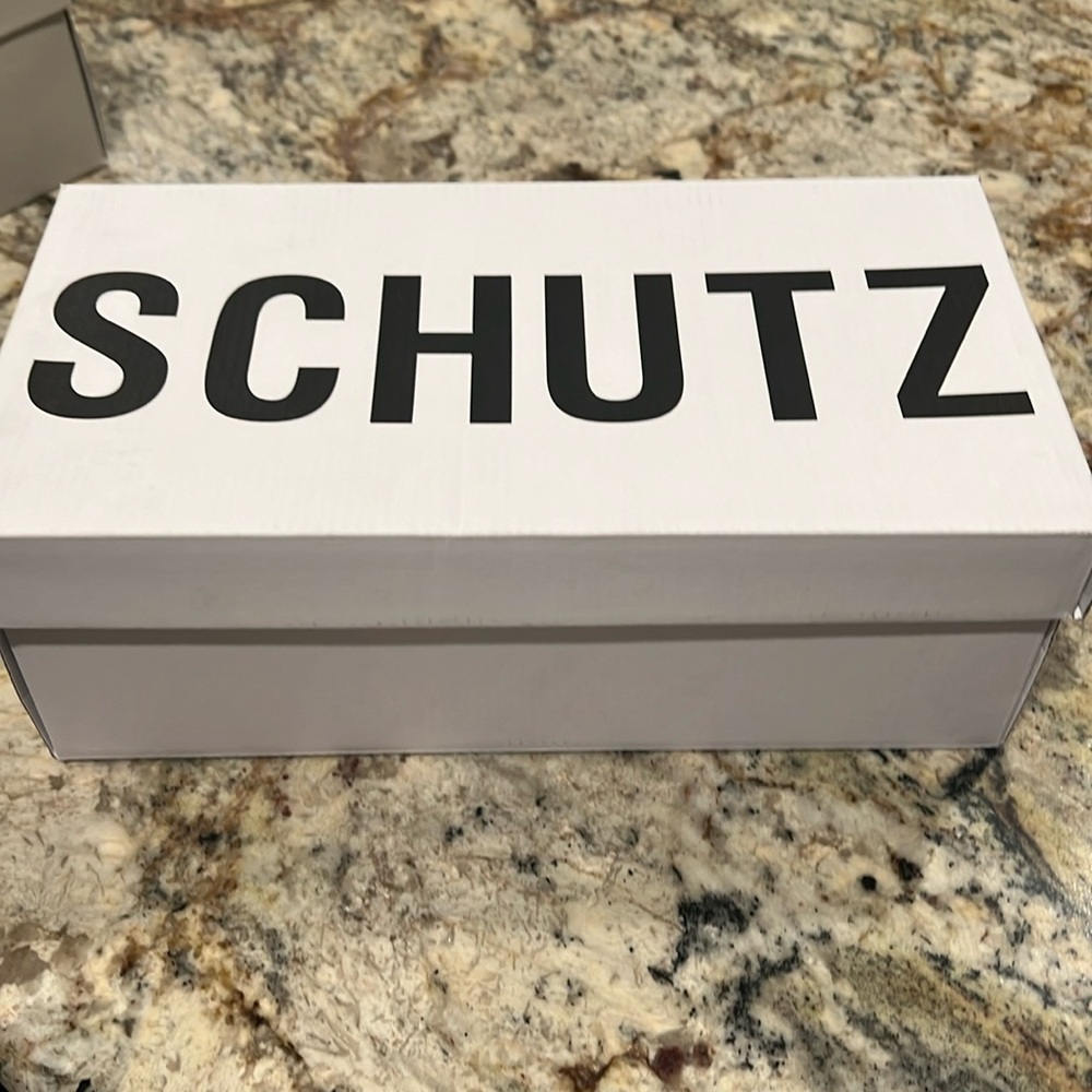 Schutz brand, black and silver slide with little heel.